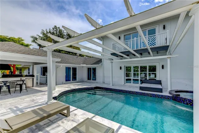 a view of a swimming pool with a patio