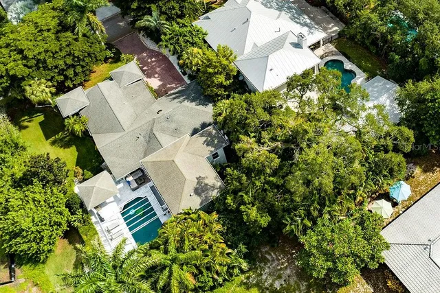 a view of a balcony with two chairs and wooden fence