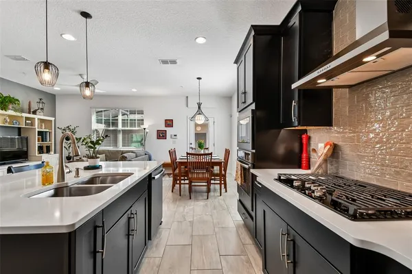 a kitchen with a table and chairs in it