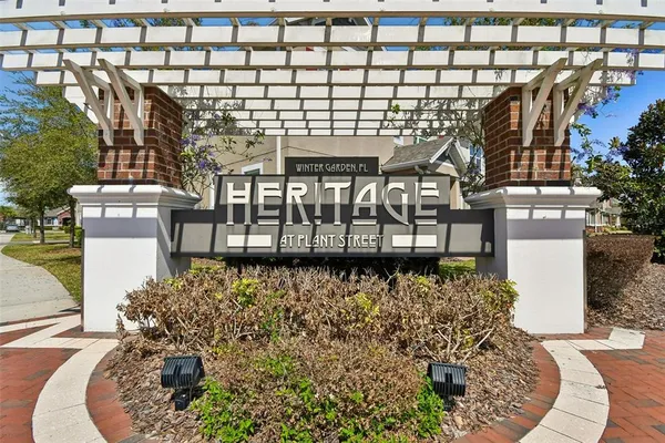 a building with glass top table and chairs