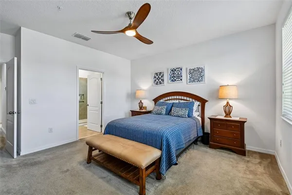 a bedroom with a bed and a cabinets