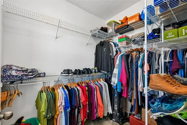 a bathroom with a sink a toilet a mirror and shower