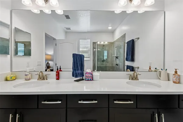 a dining room with furniture a chandelier and window