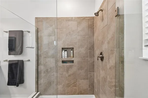 a view of a chairs and table in the balcony