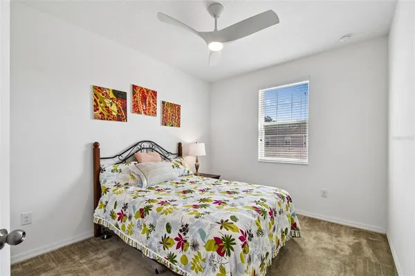 a living room with furniture a window and a wooden floor