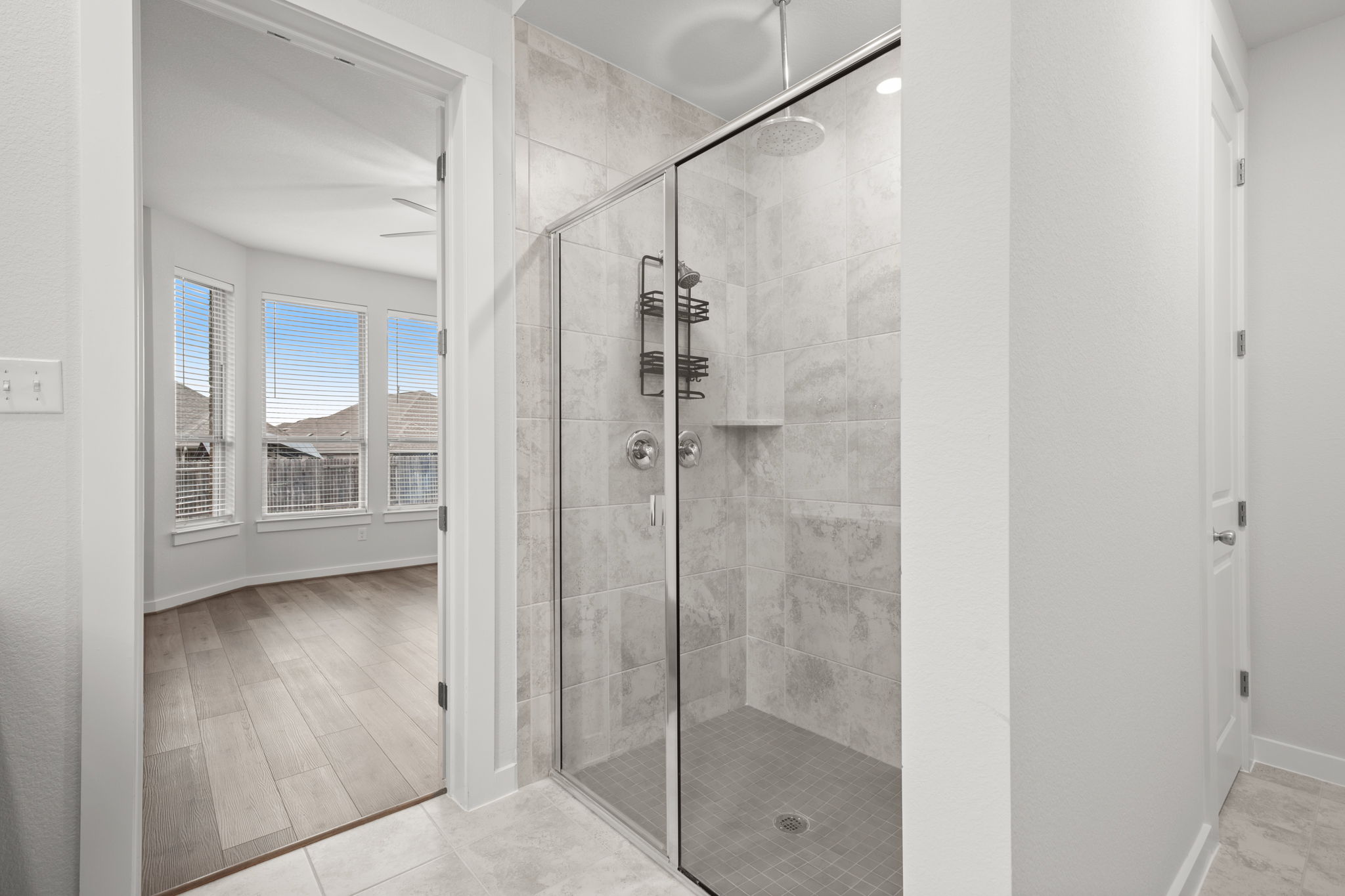841 Spinnaker Loop Kyle, TX 78640 - Photo 26 of 40 Bathroom featuring a shower stall and baseboards
