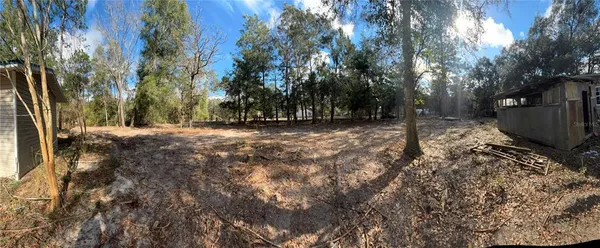 a kitchen with kitchen island granite countertop a sink stainless steel appliances and cabinets
