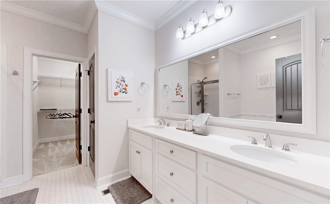 1001 Reserve Lane St. Simons Island, GA 31522 - Photo 21 of 28 Primary Bath with Double Vanity and Walk-In Closet.