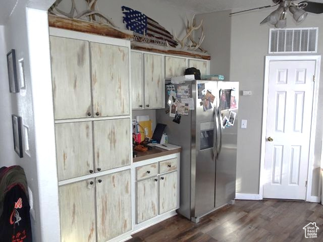 34685 Highway 30 Georgetown, ID 83239 - Photo 4 of 21 Kitchen with a ceiling fan, visible vents, dark wood-style flooring, and stainless steel fridge with ice dispenser