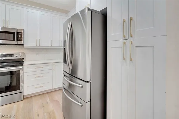 a bathroom with double sink and a mirror