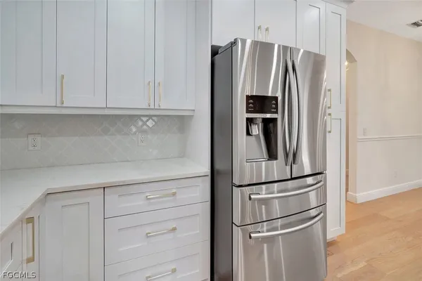 a view of walk in closet with clothes