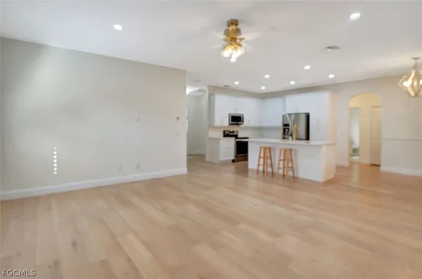 a bedroom with a bed and a tv on the dresser