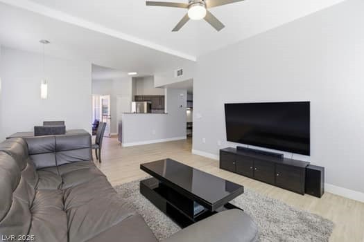 10550 West Alexander Road, Unit 2091 Las Vegas, NV 89129 - Photo 12 of 43 Vaulted ceilings, ceiling fans, and flow through to kitchen.