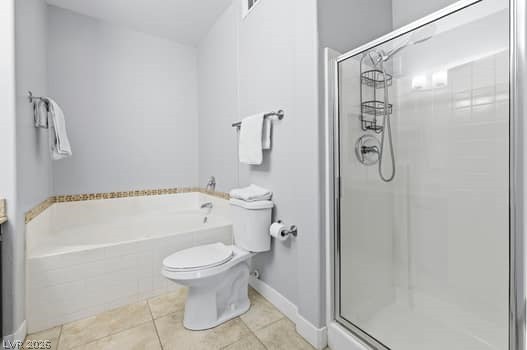 10550 West Alexander Road, Unit 2091 Las Vegas, NV 89129 - Photo 24 of 43 Walk-in shower, separate soaking tub, and tile flooring in primary bathroom.