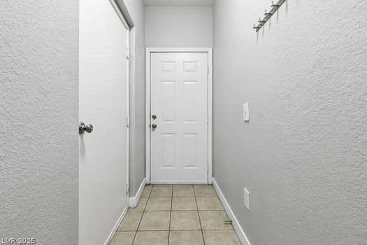 10550 West Alexander Road, Unit 2091 Las Vegas, NV 89129 - Photo 7 of 43 Tiled foyer with garage and front door entries.
