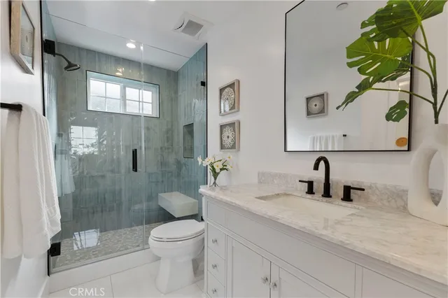 a bathroom with a shower and toilet