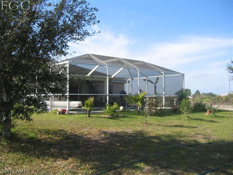 3618 20th Street Southwest Lehigh Acres, FL 33976 - Photo 12 of 12 a view of a house with backyard and sitting area