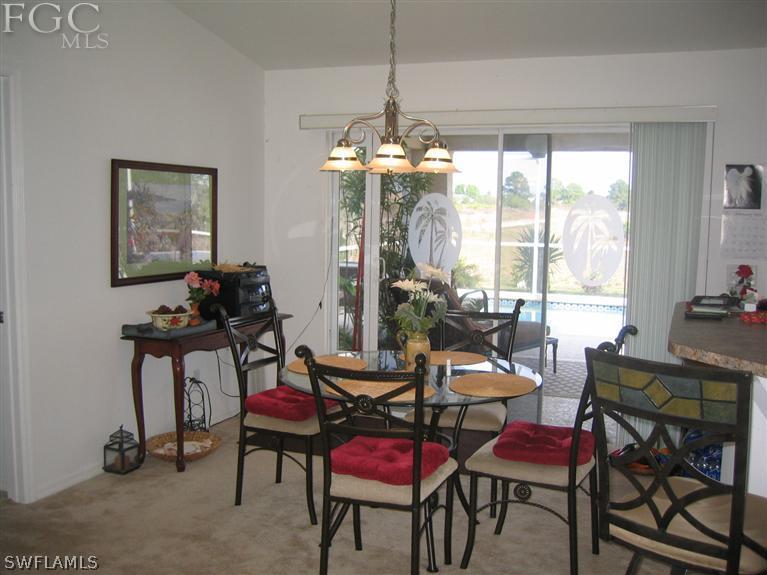 3618 20th Street Southwest Lehigh Acres, FL 33976 - Photo 6 of 12 a view of a dining room with furniture window and outside view