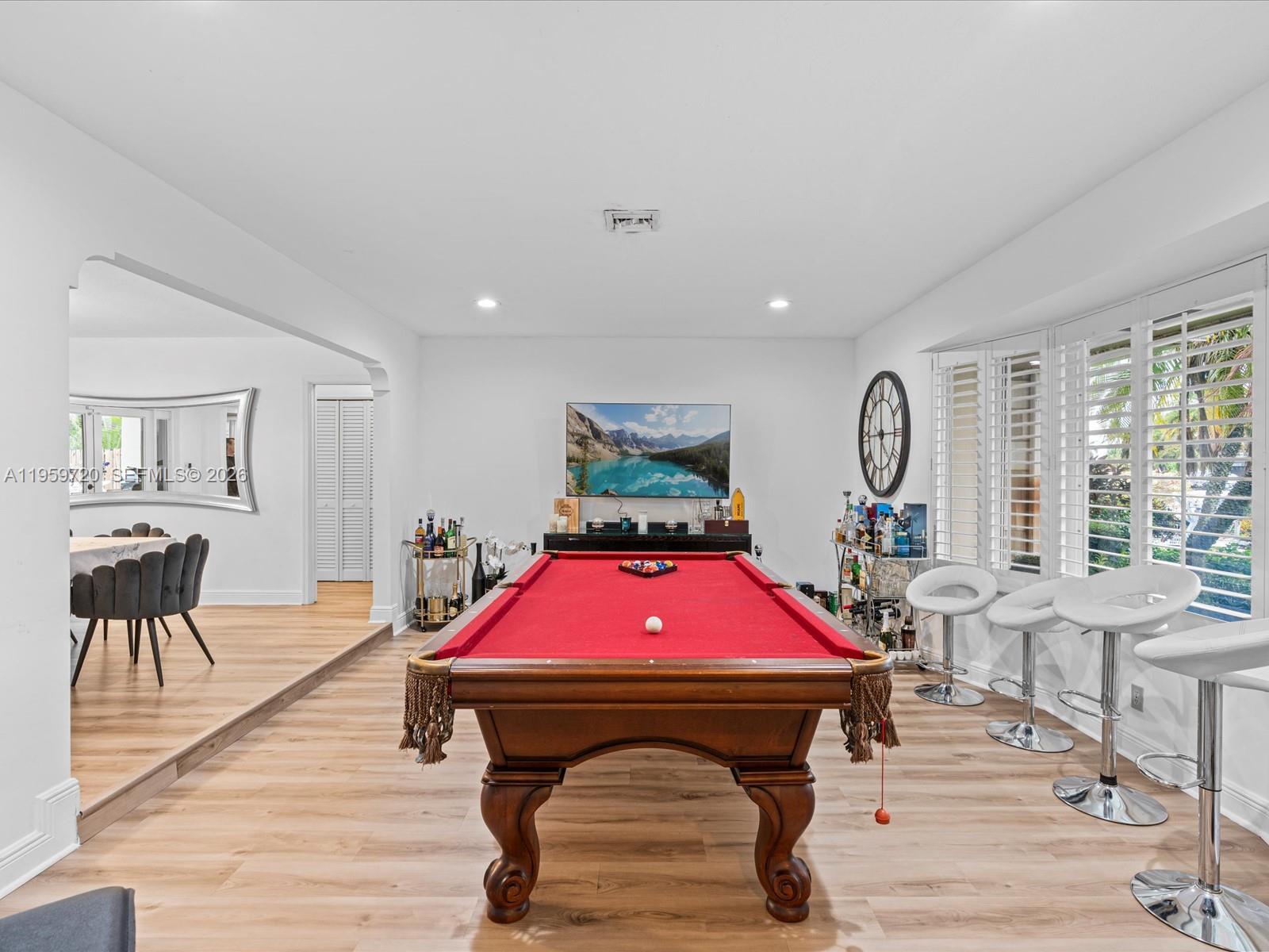 1113 North 46th Terrace Hollywood, FL 33021 - Photo 13 of 41 a living room with furniture a table and a large window