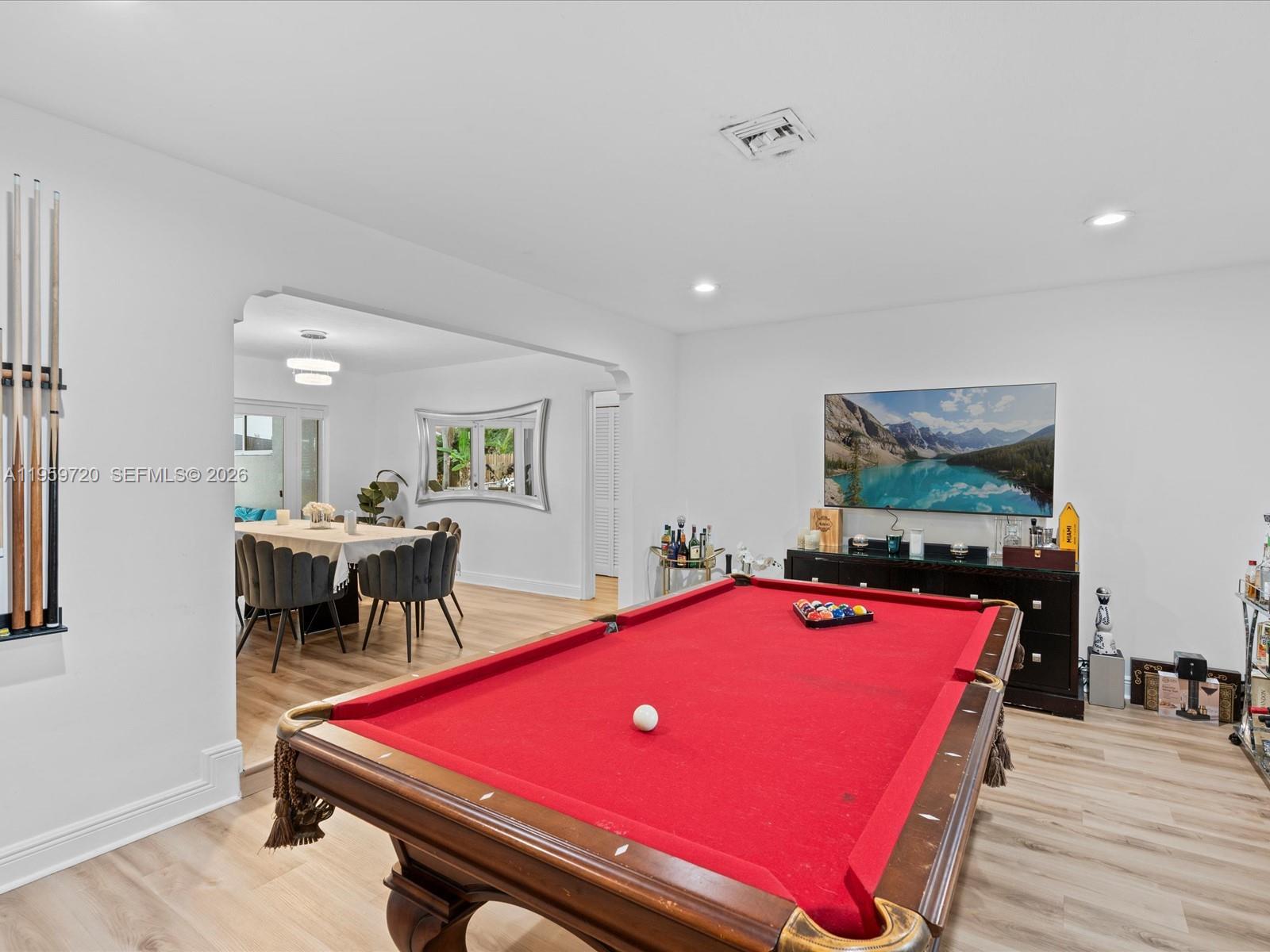 1113 North 46th Terrace Hollywood, FL 33021 - Photo 14 of 41 a room with furniture pool table and windows