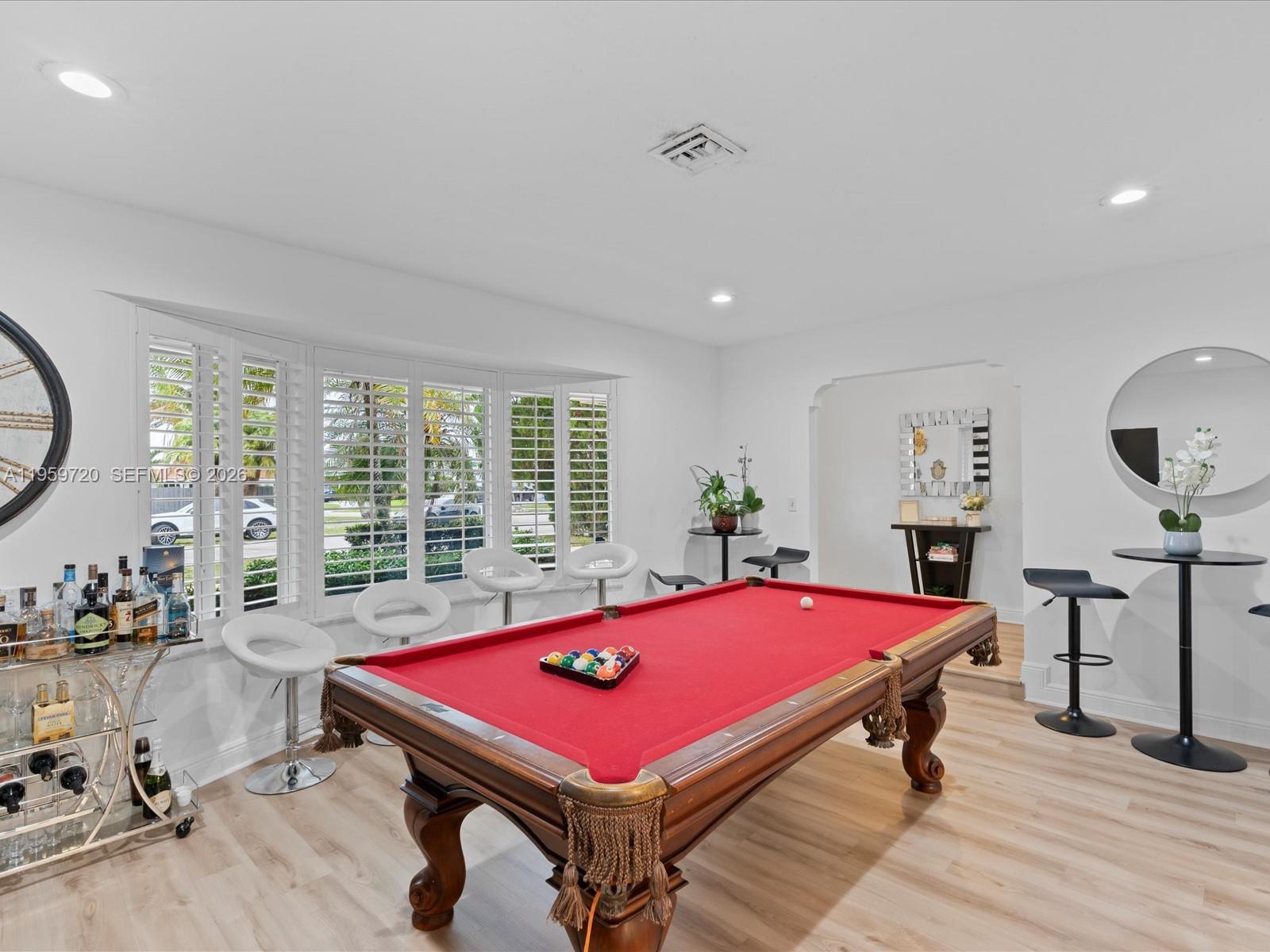 1113 North 46th Terrace Hollywood, FL 33021 - Photo 16 of 41 a room with pool table and windows