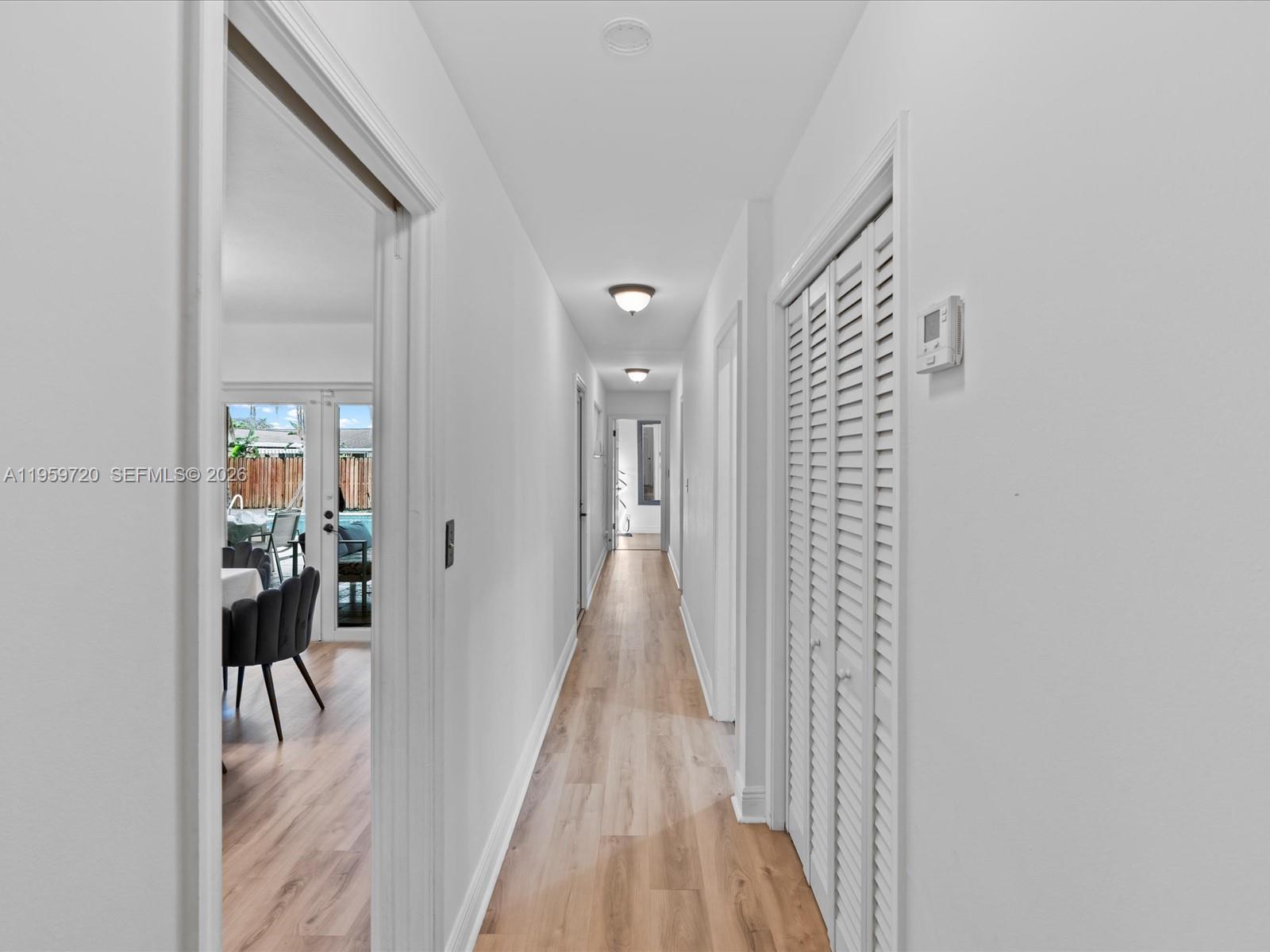 1113 North 46th Terrace Hollywood, FL 33021 - Photo 26 of 41 a view of a hallway with wooden floor and staircase