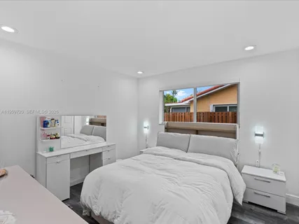 a bedroom with a bed and a closet