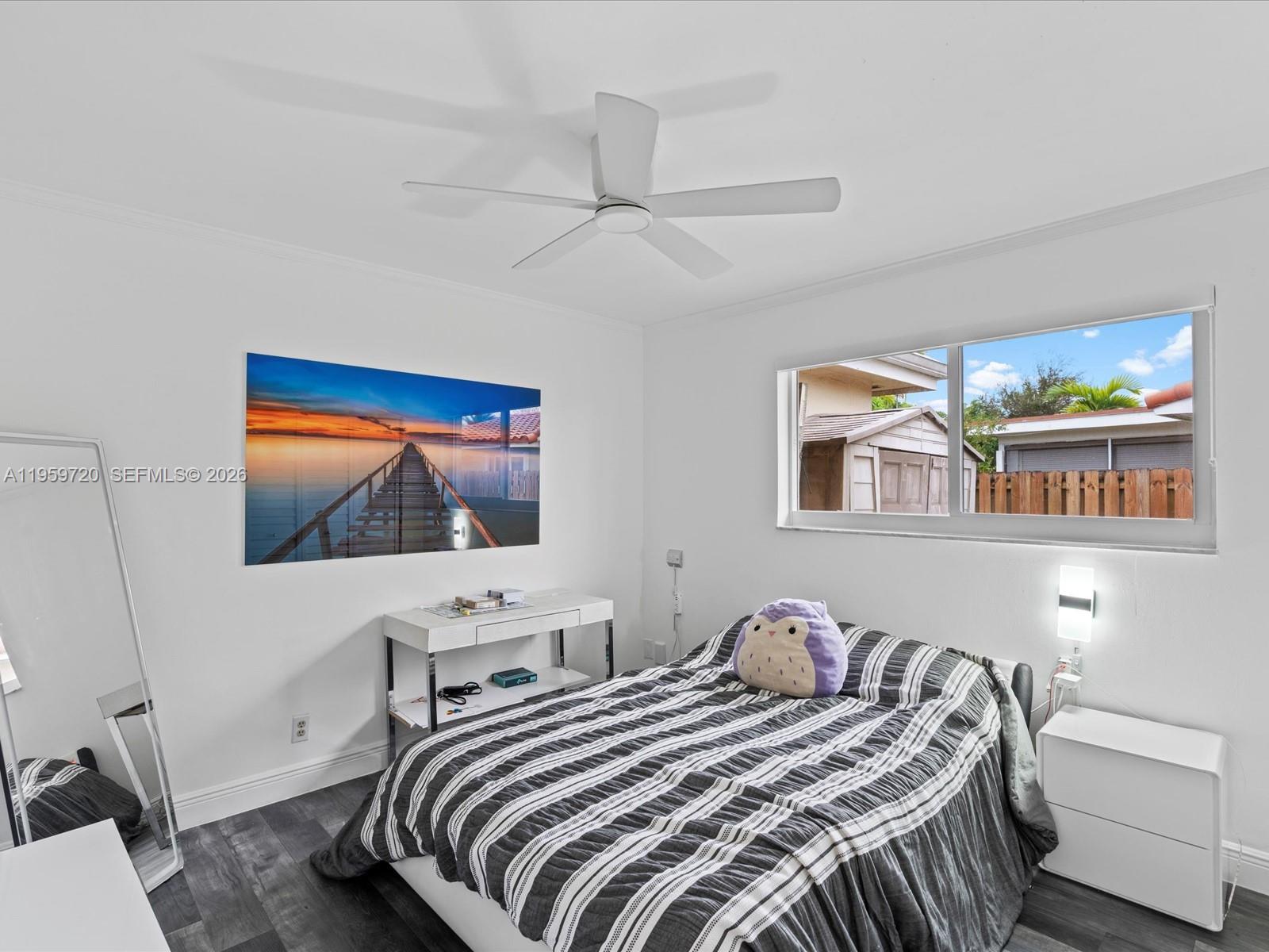 1113 North 46th Terrace Hollywood, FL 33021 - Photo 31 of 41 a bedroom with a bed and a flat screen tv