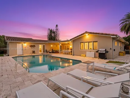 a view of a house with swimming pool