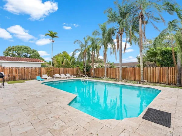 a view of a house with a swimming pool