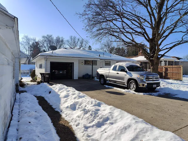 a view of a car parked in front of house