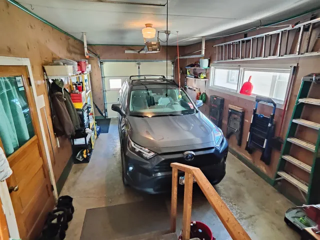 a view of gym equipment with wooden floor