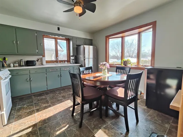 a view of a dining room with furniture window and outside view