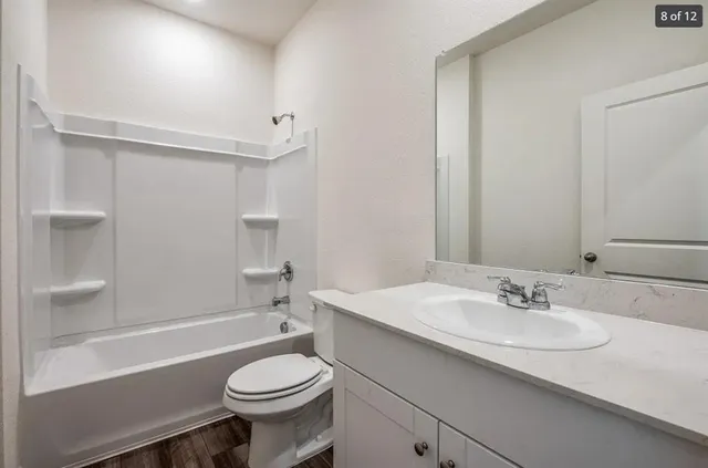a bathroom with a sink toilet and a bathtub