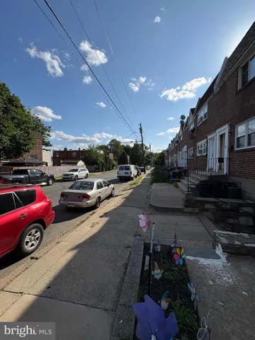 a view of a city street with cars