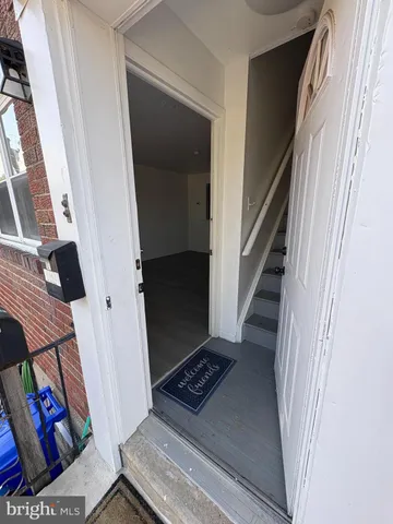 wooden floor in an empty room with a fireplace