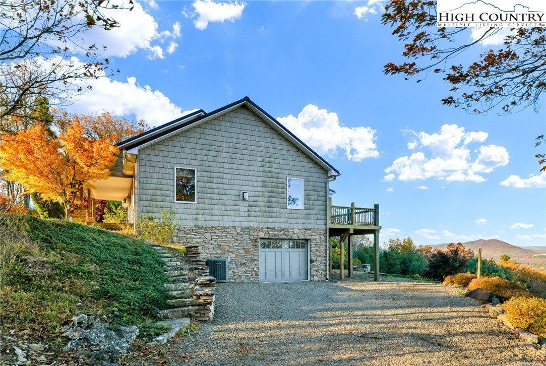 324 Rocky Ridge Lane Glade Valley, NC 28627 - Photo 12 of 43 a view of a house with a patio