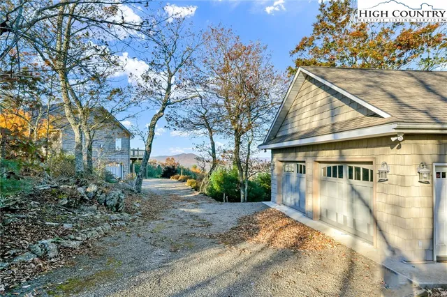 a living room with furniture a flat screen tv and a table
