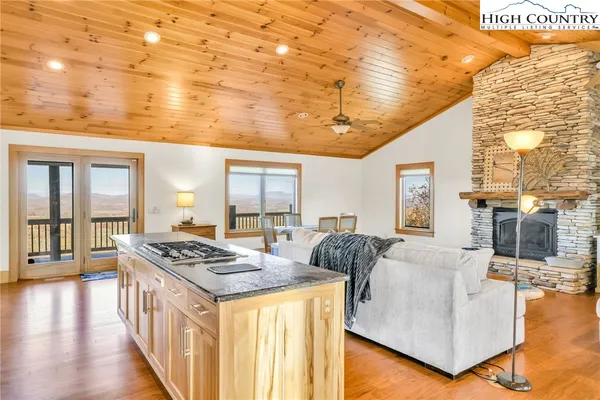 a living room with fireplace furniture and a flat screen tv