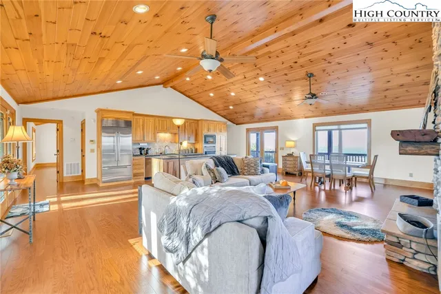 a kitchen with granite countertop white cabinets and sink