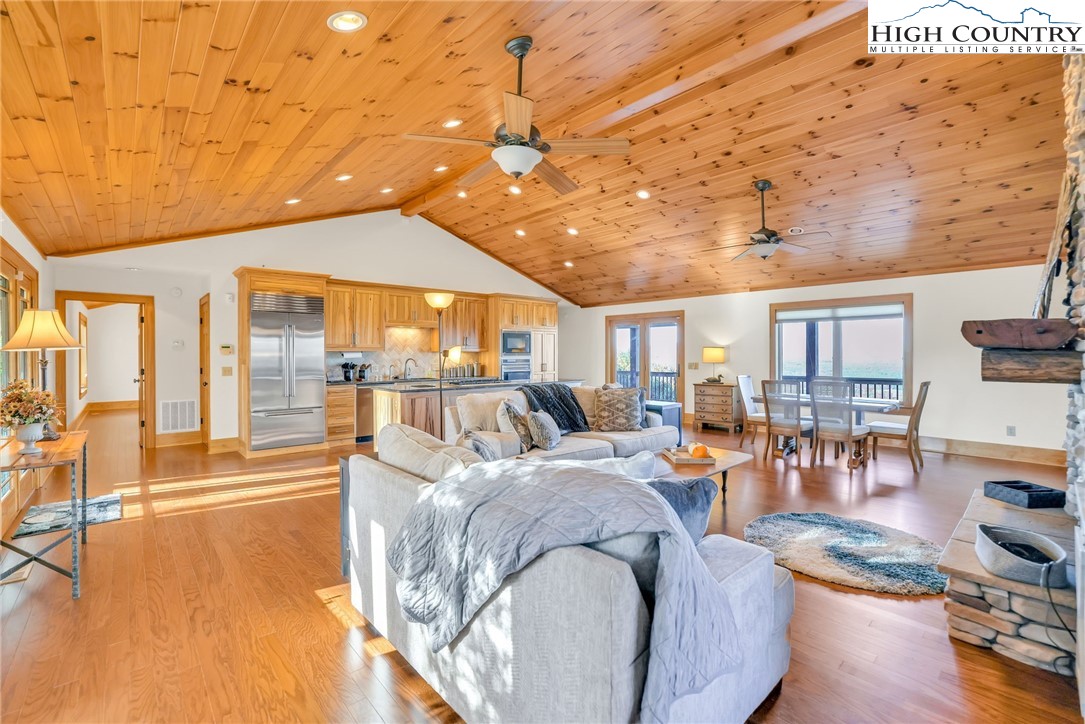 324 Rocky Ridge Lane Glade Valley, NC 28627 - Photo 18 of 43 a living room with fireplace furniture and a flat screen tv