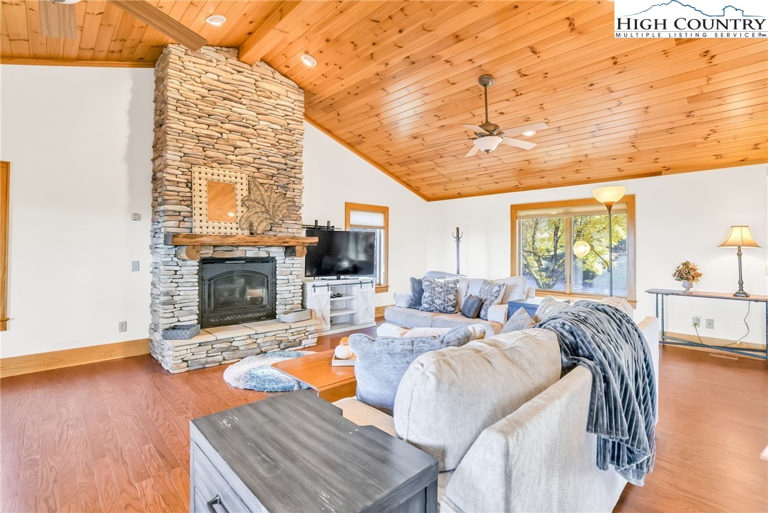 324 Rocky Ridge Lane Glade Valley, NC 28627 - Photo 21 of 43 a bed room with a bed and a fireplace