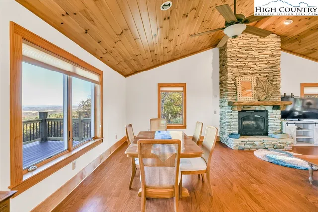 a living room with fireplace furniture and a wooden floor
