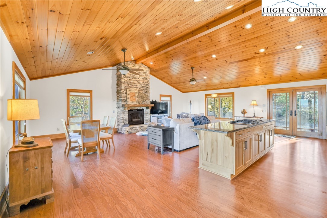 324 Rocky Ridge Lane Glade Valley, NC 28627 - Photo 23 of 43 a living room with fireplace furniture and a wooden floor