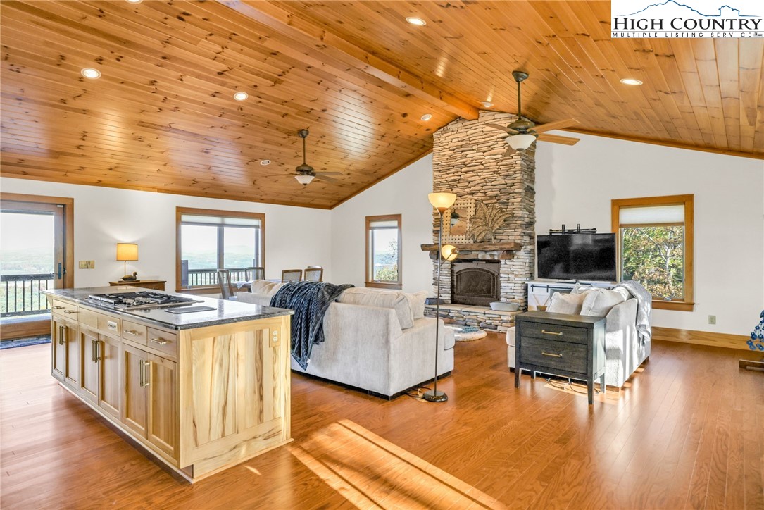 324 Rocky Ridge Lane Glade Valley, NC 28627 - Photo 27 of 43 a living room with fireplace furniture and a flat screen tv