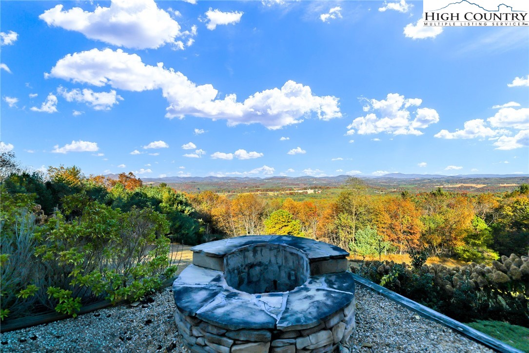 324 Rocky Ridge Lane Glade Valley, NC 28627 - Photo 3 of 43 a view of a lake with a swimming pool