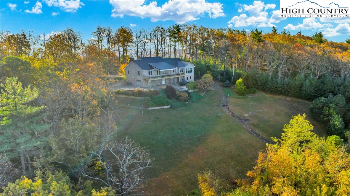 324 Rocky Ridge Lane Glade Valley, NC 28627 - Photo 4 of 43 a view of a lake with a yard