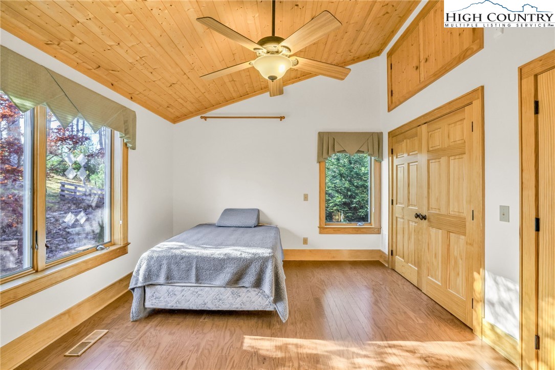 324 Rocky Ridge Lane Glade Valley, NC 28627 - Photo 42 of 43 a bedroom with wooden floor