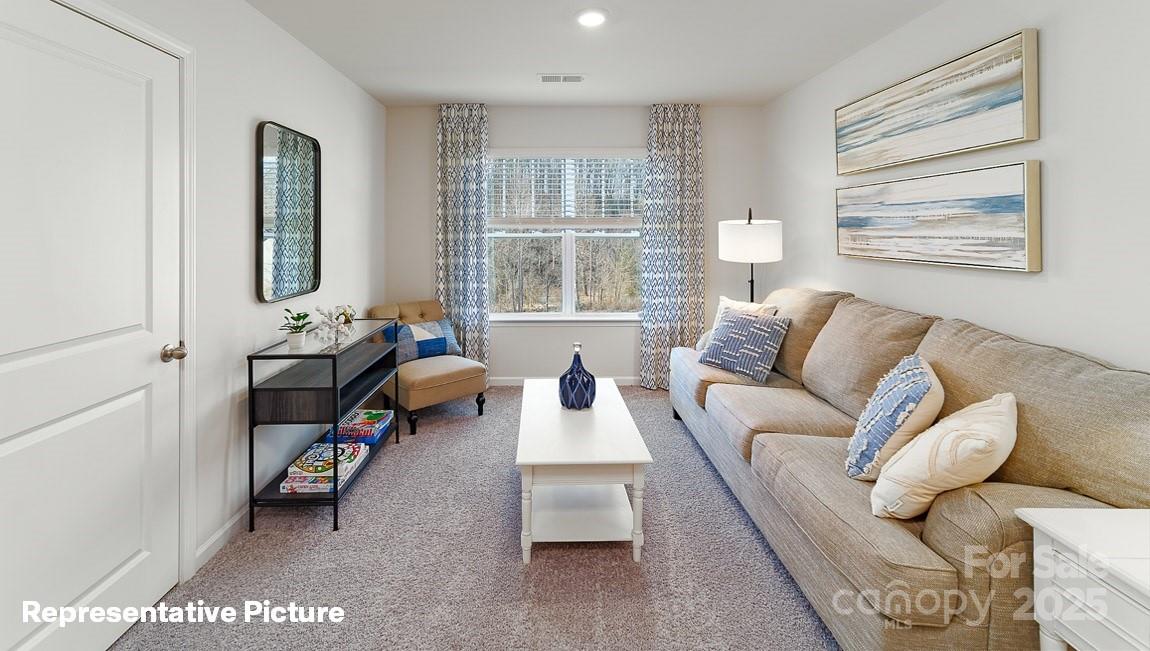 195 Superstar Street Salisbury, NC 28147 - Photo 34 of 35 a living room with furniture and a window