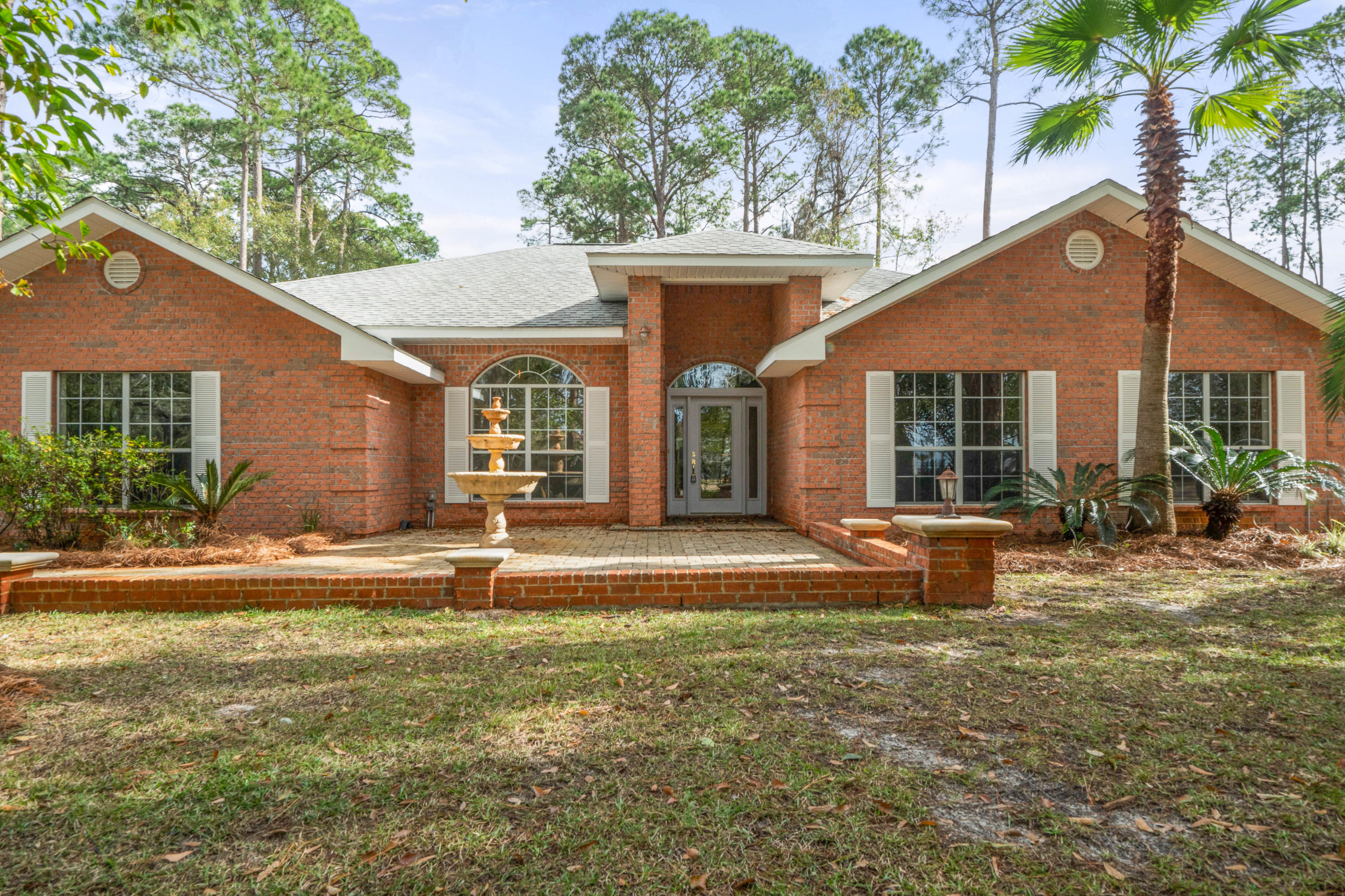 414 Driftwood Point Road Santa Rosa Beach, FL 32459 - Photo 1 of 36 front view of a house with a yard